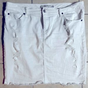 Plus size white, distressed style, denim skirt.